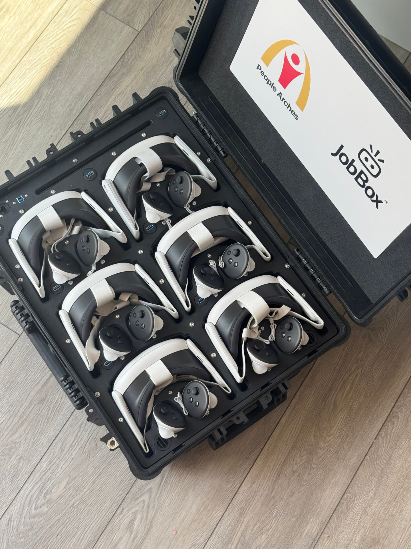 Top-down view of ten headsets in custom-cut foam